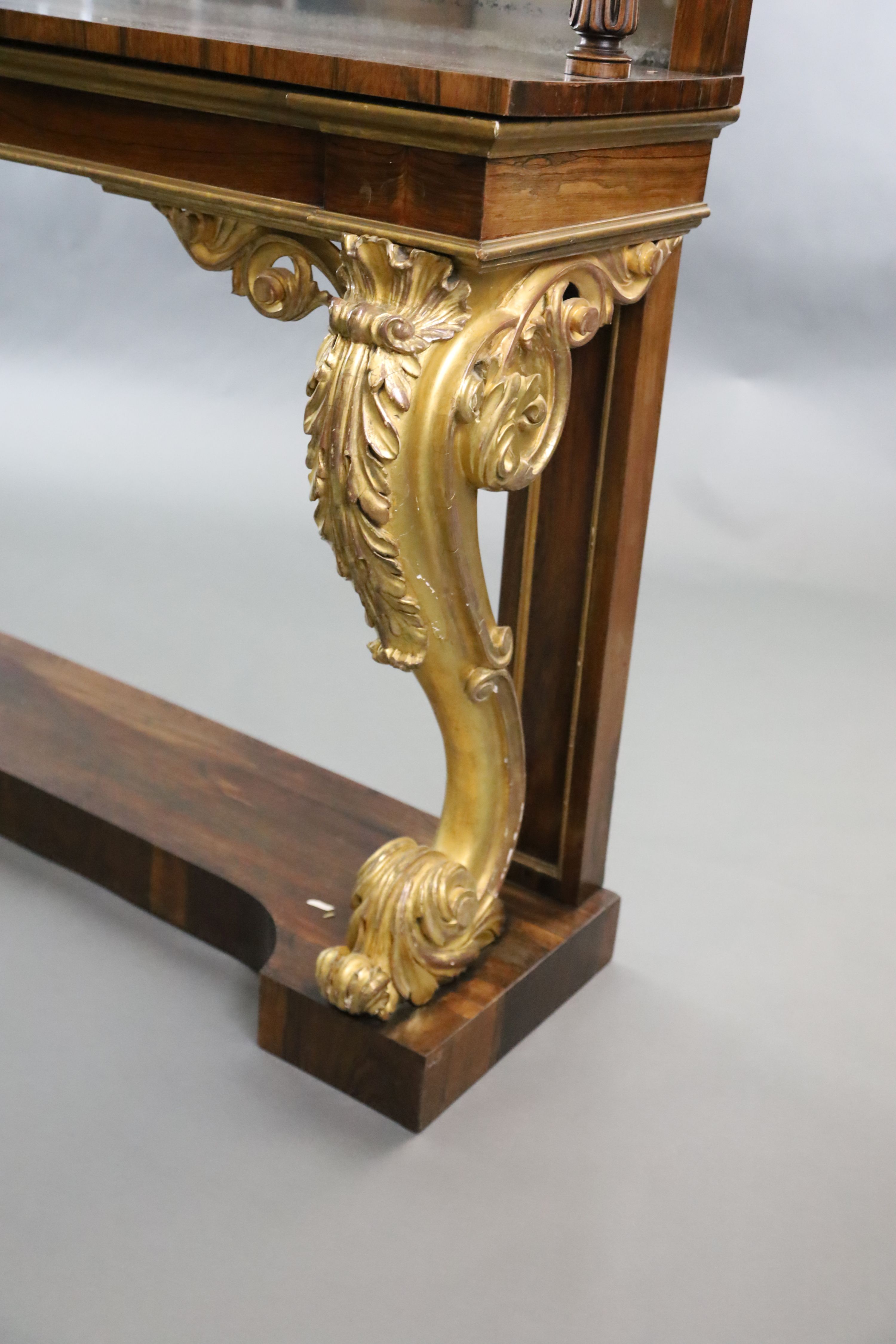 A pair of William IV parcel gilt rosewood console tables, W.8ft 2in. D.1ft 4in. H.4ft 4in.